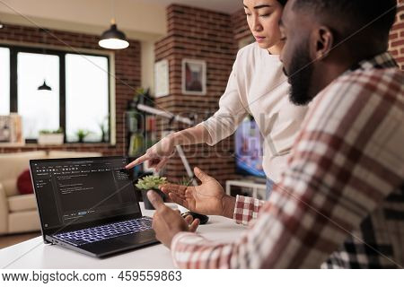 Programmers Couple Coding Security Firewall On Laptop, Using Html And Temrinal Window To Develop New