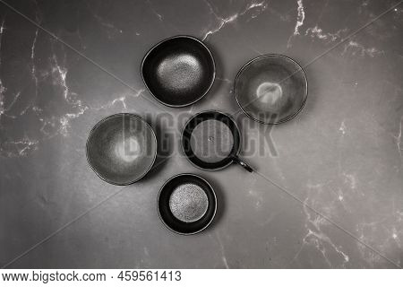 Cermic Bowls On A Gray Marble Kitchen Counter In A Top View
