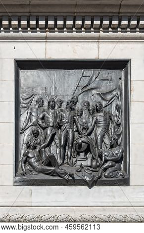 London, Uk- July 4, 2022: Trafalgar Square. Closeup Of Black Mural Sculpture Set In White Marble Ped