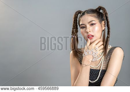 Portrait Of Smiling Cheerful Beautiful Pretty Asian Fashion Woman Posing Smile In Black Fashion Clot