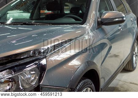 Installation Of A Protective Paint And Varnish Transparent Film On The Car. Ppf Polyurethane Film To