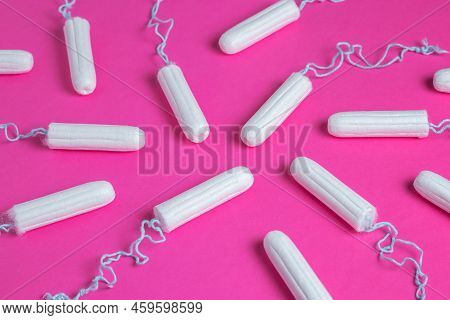 Medical Female Tampon On A Pink Background. Hygienic White Tampon For Women. Cotton Swab. Menstruati