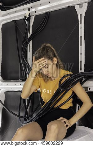 Vertical View Of Young Woman Worried About How To Build And Assamble The Electricity Wiring Of The S