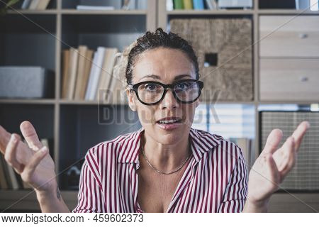 Confused Doubtful Woman Feeling Baffled Looking At Camera Unaware About Problem. Portrait Of Clueles