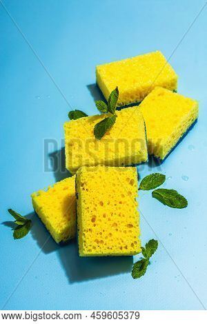 Bright Yellow Sponges For Washing Dishes. Organic Cleaning Concept, Minty Freshness