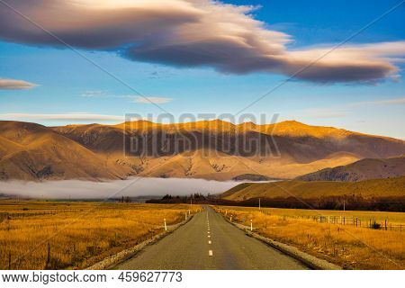Low And High Cloud Formations Over The Mountains At Ohau Road Near Twizel