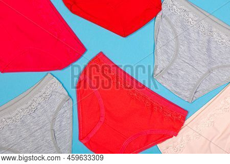Clothes For Children In The Form Of Panties On A Blue Background. Clothes For Children From Soft Fab