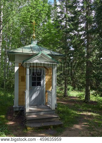 In Old Cemetery Of Uusi Valamo Orthodox Monastery In Finland: Chapel, Crosses, Orthodox Tradition.