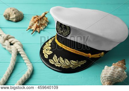 Peaked Cap, Rope And Shells On Turquoise Wooden Background
