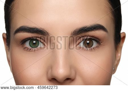 Woman With Beautiful Eyes Of Different Colors, Closeup. Heterochromia Iridis