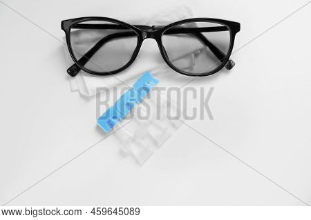 Single Dose Eye Drops, Glasses And Fabric On White Table, Above View