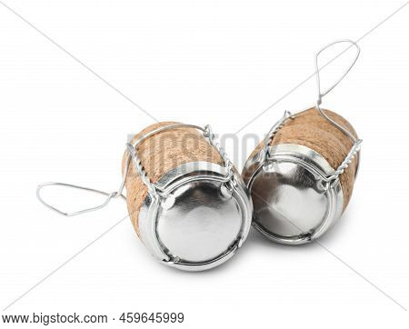 Sparkling Wine Corks With Muselet Caps On White Background