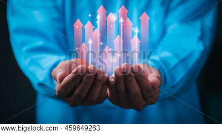 Young Businessman Showing Business Growth Icon In Hand Ideas For Developing Business Strategies And 