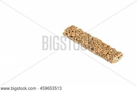 A Strip Of Sweet Kozinaki Dessert On A White Background With Space For Text. Kozinaki Is An Oriental