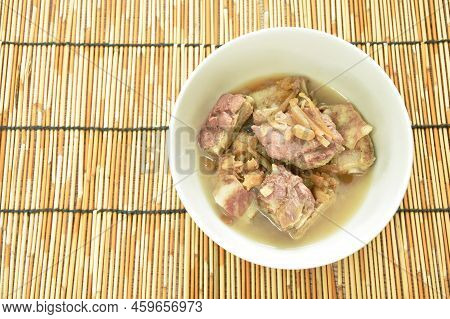 Steamed Pork Bone Topping Slice Ginger And Ham In Gravy Sauce On Bowl