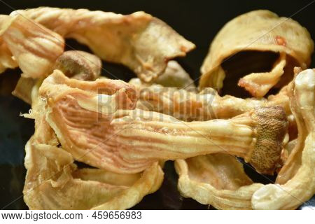 Crispy Fried Duck Innards On Plate Dipping With Sweet Black Soy Sauce