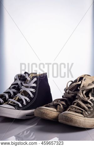 Old And New Classic Sneakers On A White Background.