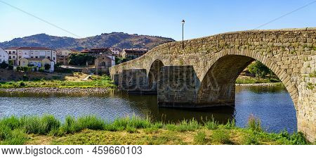 Medieval Stone Bridge Over The River Tormes As It Passes Through The Old Village Of Barco De Avila, 