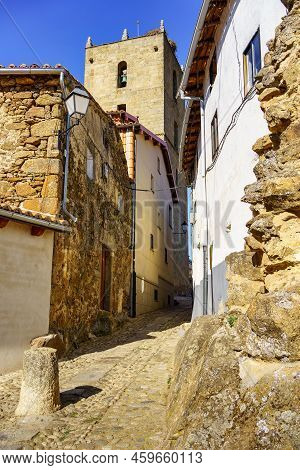 Narrow Alley With Its Picturesque Old Houses And The Tower Of The Village Church In The Background, 