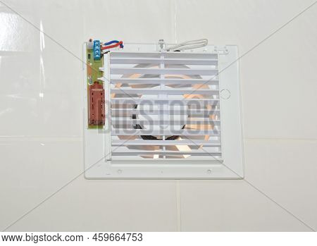 Bath Fan Repair, Close Up. Repair Bath Vent Fan, Ventilation System In The House Bathroom .