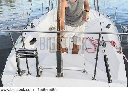 A Man On A Boat Paints Objects. Boat Work. Maintenance Of Yachts And Boats.