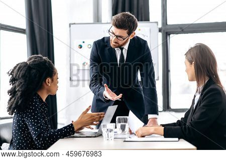 Elegant Caucasian Intelligent Male Boss, Holding Group Brainstorm With Female Colleagues, Discussing