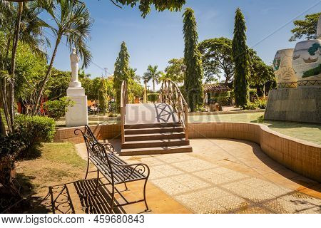A Nice And Relaxed Park With A Wooden Bridge Over A Water Fountain, Traditional Park Of Nagarote, Ni
