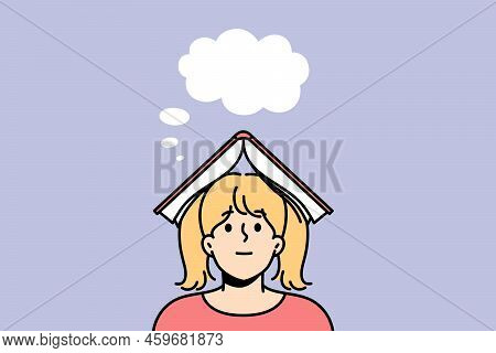 Small Girl With Book On Head Dreaming Or Fantasizing. Little Child Enjoy Literature Imagining Or Vis