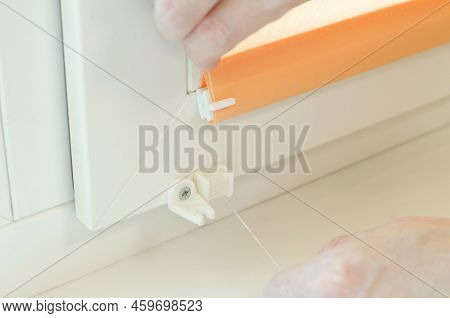 Assembly Of Roller Blinds. Hands Are Assembling Roller Blinds, Close-up