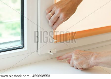 Assembly Of Roller Blinds. Hands Are Assembling Roller Blinds, Close-up
