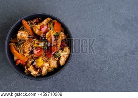 Chicken Yakissoba In Black Ceramic Bowl - Top View.