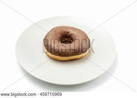 Tasty Donut Dessert With Chocolate Glossy Glaze In A Plate, Isolated On White Background. One Round 