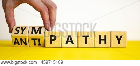From Antipathy To Sympathy. Businessman Turns Cubes And Changes The Word 'antipathy' To 'sympathy'. 