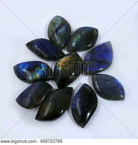 Polished Labradorite Stones On A White Background. It's Found In Canada, Poland, Norway, Finland And