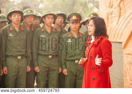 Dien Bien Phu, Vietnam - February 26, 2012: Vietnamese Professor Woman Lecturing To Young Vietnamese