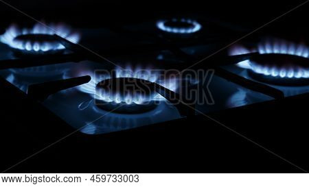 The Blue Flame Of The Gas Stove Burner On A Black Background. The Concept Of Energy Risis. Selective