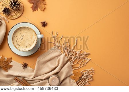 Autumn Concept. Top View Photo Of Cup Of Coffee On Saucer Cinnamon Sticks Candle Anise Yellow Maple 