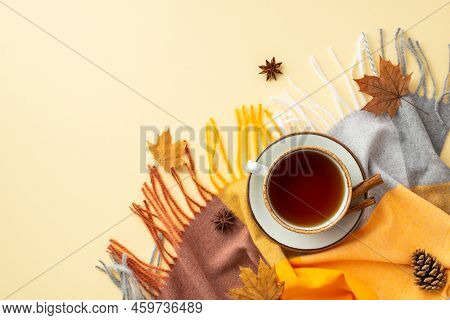 Autumn Inspiration Concept. Top View Photo Of Cup Of Tea And Cinnamon Sticks On Saucer Anise Yellow 