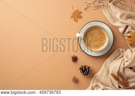 Autumn Aesthetic Concept. Top View Photo Of Cup Of Cocoa On Saucer Yellow Maple Leaves Cinnamon Stic