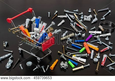 Different Types Of Fasteners In A Supermarket Trolley. Place For Text Or Logo. Concept: Fastener Sto