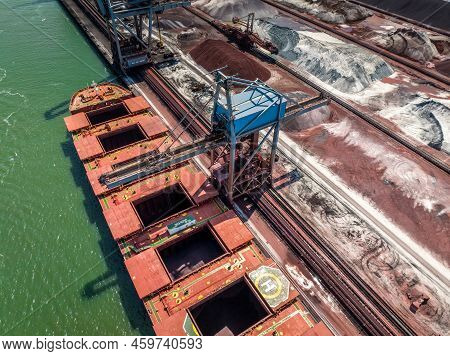 Bulk Carrier Ship Unloading Cargo At A Port Depot