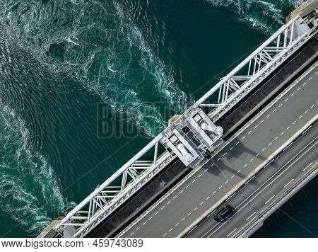Water Rushing Through A Storm Surge Barrier In The Netherlands