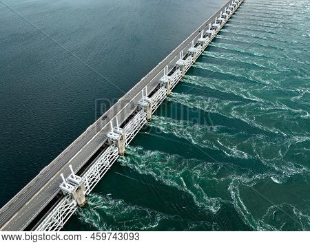Water Rushing Through A Storm Surge Barrier In The Netherlands