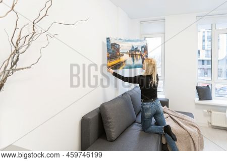 Photo Canvas Print. A Woman Holding A Photography With Gallery Wrap. Photo Printed On Glossy Synthet
