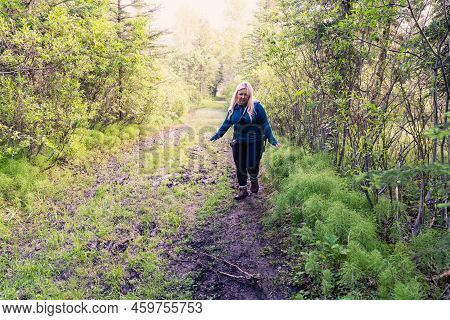 Cautious Woman Hiker Walks Through A Muddy Trail In Kananaskis Country In Alberta Canada