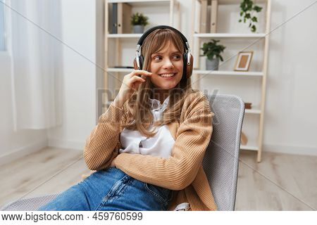 Cute Joyful Young Blonde Lady In Warm Sweater In Headphones Dreaming Looks Aside Listen Fav Songs Si
