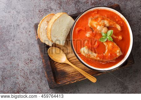 Fish Tomato Soup With Carp Steak, Vegetables And Paprika Close-up In A Bowl On The Table. Horizontal
