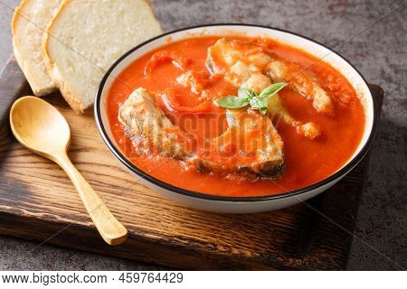 Fishermans Soup Or Halaszle Is A Hot, Spicy Paprika Based Fish Soup Closeup In The Bowl On The Woode