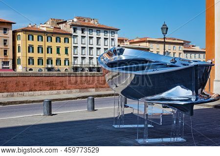 Pisa, Italy - Мay 23, 2022: Exhibit Of A Boat With Mirror Silver Surface Near The Santa Cristina Rom