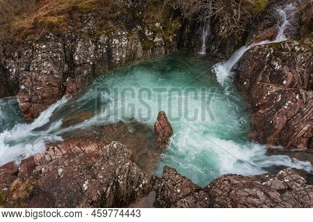 Beautiful Aerial Drone Landscape Image Of Vibrant River Coe Flowing Beneath Snowcapped Mountains In 